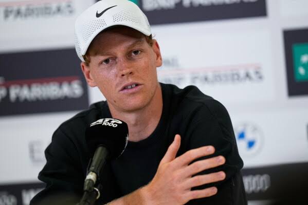 Jannik Sinner reacts after Novak Djokovic and Alexander  Zverev order the court following his successful defense of the Wimbledon crown …